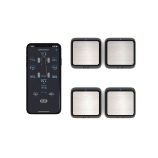 Cztery obciążniki narożne SkyRc i telefon z aplikacją pomiarową.