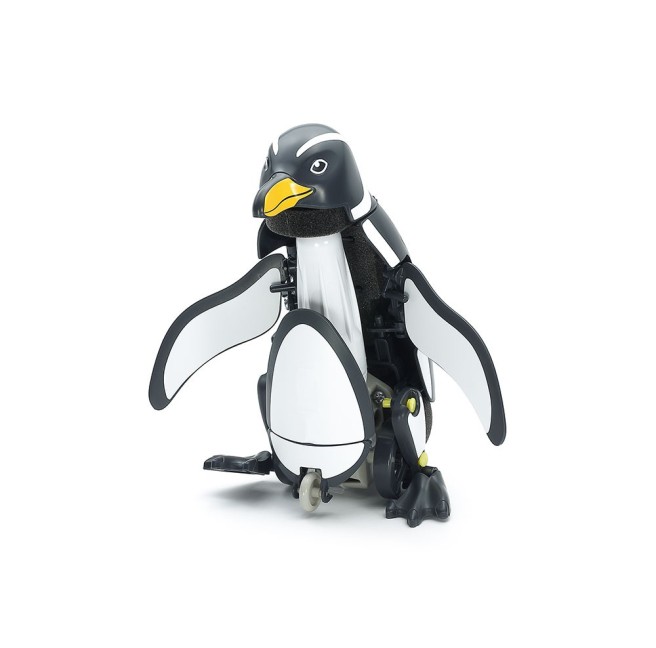 Toy penguin on batteries that can walk and swim isolated on white.