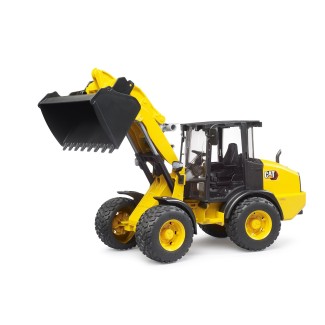 Yellow wheeled loader Caterpillar by Bruder brand with raised bucket.