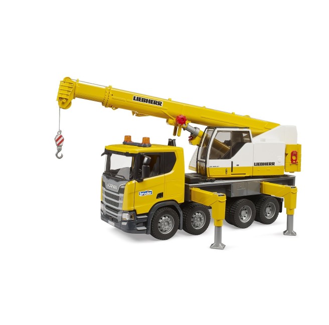 Scania Super 560R truck with yellow Liebherr crane